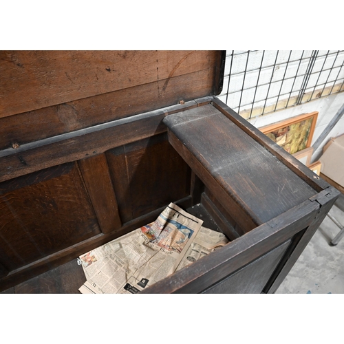 232 - An antique panelled oak mule chest with hinged top and two drawers, 148 x 60 x 88 cm h