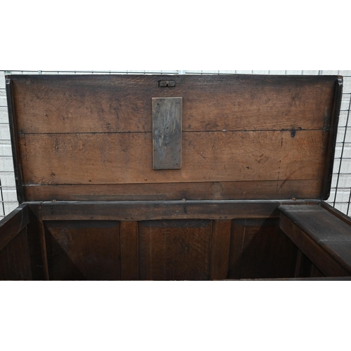 232 - An antique panelled oak mule chest with hinged top and two drawers, 148 x 60 x 88 cm h