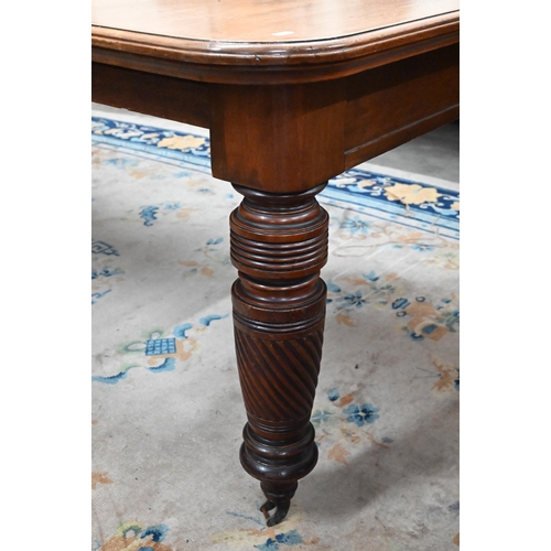 106 - A late 19th century mahogany extending dining table with four central leaves, on turned spiral reede... 