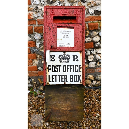 10 - A cast iron 'ER' branded mail box, wooden back, a/f