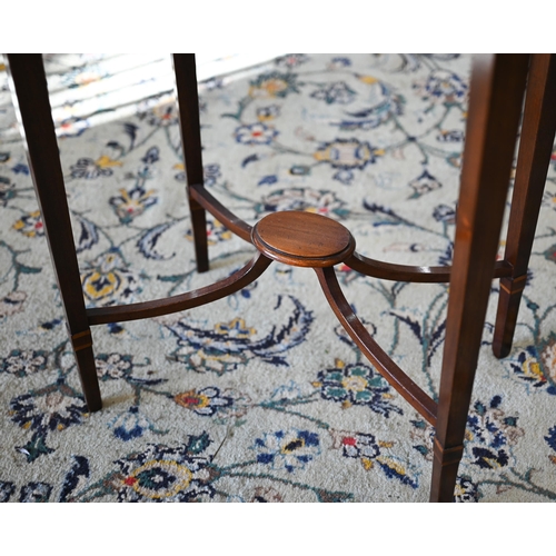 117 - A reproduction mahogany and rosewood banded oval occasional table with central inlaid fan patera, 58... 