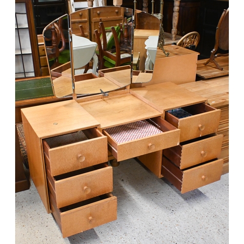 122 - A 'Meredew' light oak mirror backed dressing table with seven drawers and turned legs, 122 x 50 x 14... 