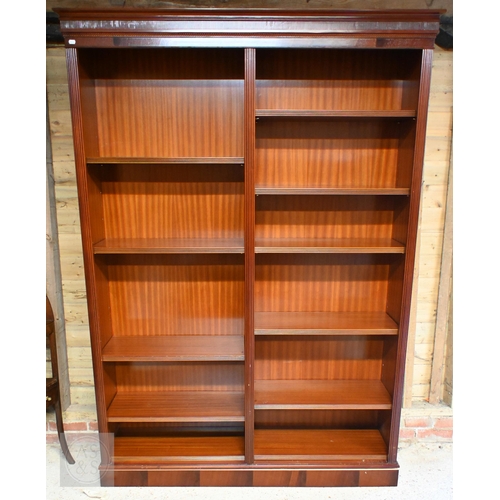 131 - A modern mahogany veneer twin division open bookcase with adjustable shelving, 150 cm wide x 33 cm d... 