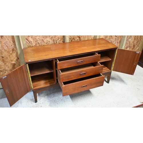 138 - A mid-century teak 'Austin Suite' sideboard with three central drawers flanked by cupboard doors (a/... 