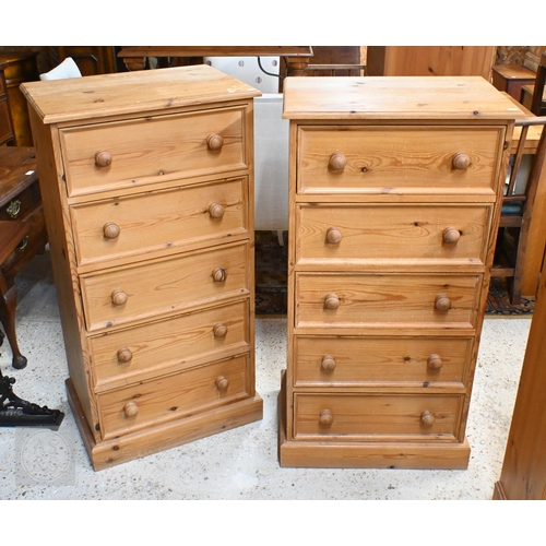 145 - A pair of pine five drawer tall boy chests with turned handles, 60 x 42 x 120 cm high to/w pine open... 