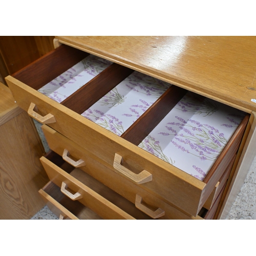 148 - A mid century light oak G Plan Brandon chest of five long graduated drawers, 76 x 45 x 98 cm high