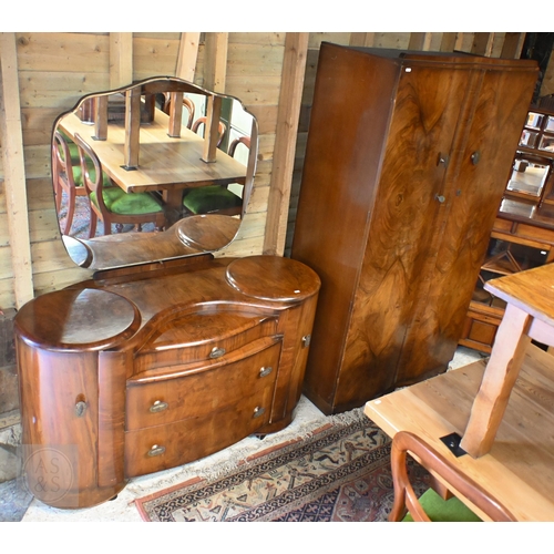 155 - A Shrager Art Deco walnut veneer dressing chest with cloud-shaped mirror over an arrangement of draw... 