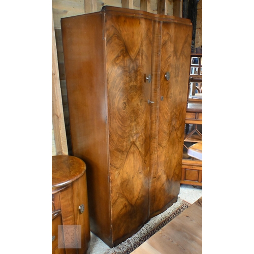 155 - A Shrager Art Deco walnut veneer dressing chest with cloud-shaped mirror over an arrangement of draw... 