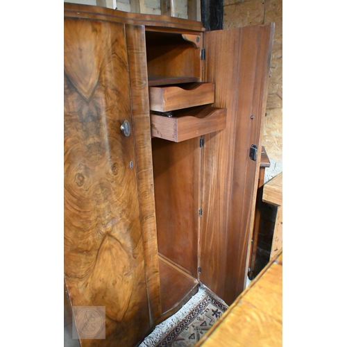 155 - A Shrager Art Deco walnut veneer dressing chest with cloud-shaped mirror over an arrangement of draw... 