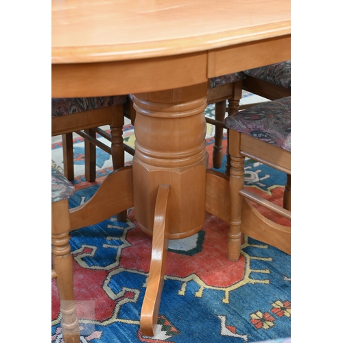 158 - A modern beech oval dining table on turned column and quadra base, 134 x 90 x 76 cm high to/w set of... 