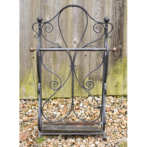 16 - A large steel and wire mesh spark guard to/w a wrought iron stick stand (2)