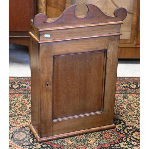 166 - A Victorian mahogany medicine cupboard with panelled door enclosing shelved interior, 40 x 14 x 62 c... 