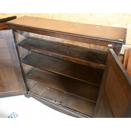 167 - An antique oak pantry cupboard with panelled doors enclosing fixed shelves, 110 x 30 x 108 cm high