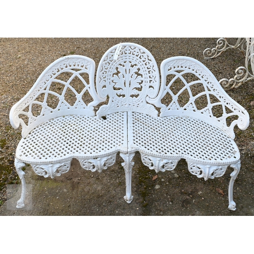 17 - A Victorian style cast alloy three seater garden bench, raised on six legs, 137 cm long