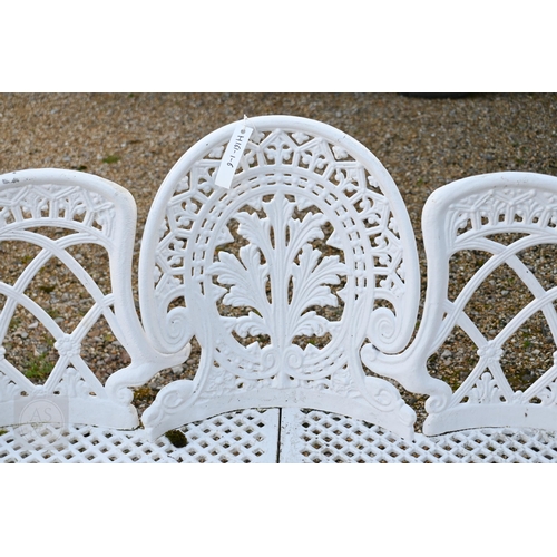 17 - A Victorian style cast alloy three seater garden bench, raised on six legs, 137 cm long