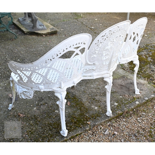 17 - A Victorian style cast alloy three seater garden bench, raised on six legs, 137 cm long