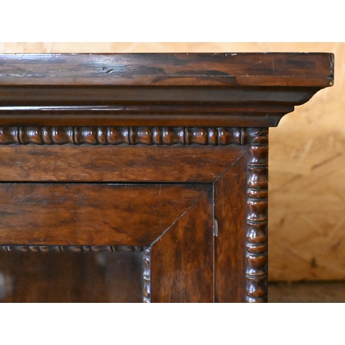 170 - A 19th century rosewood bobbin-moulded bookcase with glazed doors enclosing three shelves, standing ... 