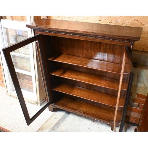 170 - A 19th century rosewood bobbin-moulded bookcase with glazed doors enclosing three shelves, standing ... 