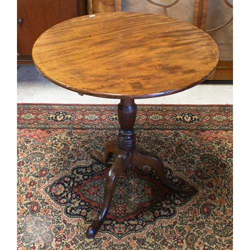 175 - A 19th century mahogany tilt-top table on turned column and triform supports, 64 cm diam x 70 cm hig... 