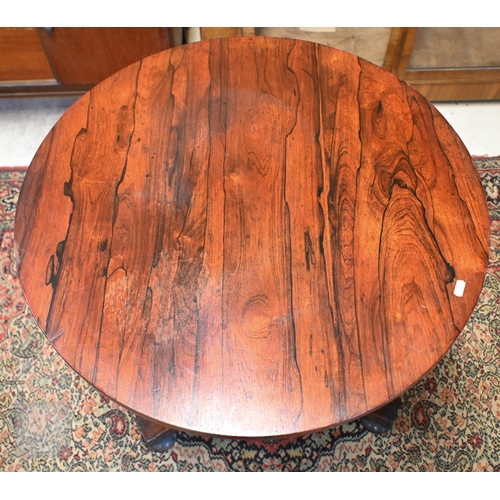 177 - A 19th century rosewood circular occasional table on concave platform base and bun feet, 68 cm diam ... 