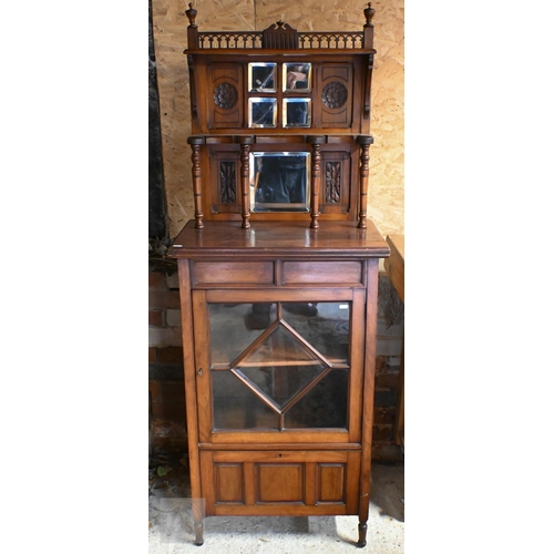 189 - An Edwardian walnut music cabinet with glazed door and raised back inset with bevelled mirrors, 60 c... 