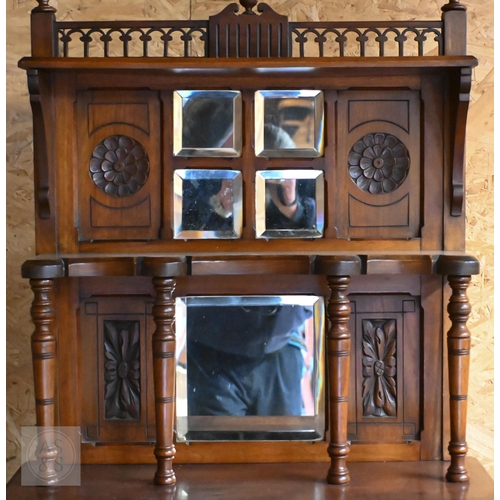 189 - An Edwardian walnut music cabinet with glazed door and raised back inset with bevelled mirrors, 60 c... 