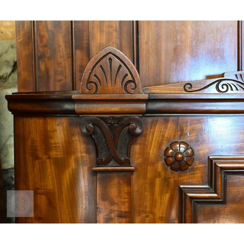 194 - A 19th century mahogany double bed with panelled headboard and curved footboard, scroll carved rails... 