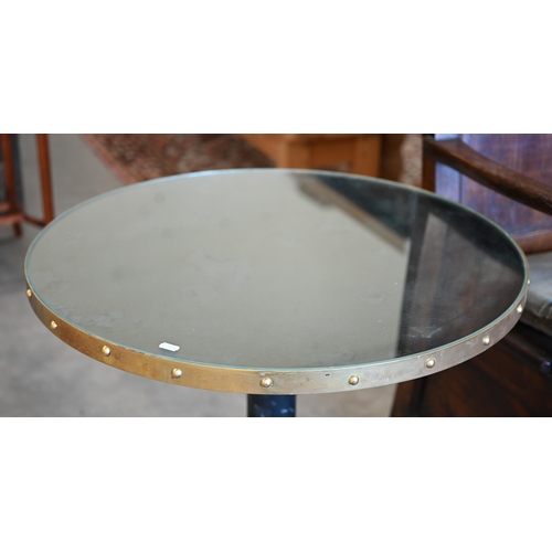 196 - Pair of circular mirror-topped tables with heavy cast iron bases, 70 cm dia x 64 cm h (2)