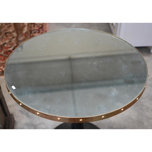 196 - Pair of circular mirror-topped tables with heavy cast iron bases, 70 cm dia x 64 cm h (2)