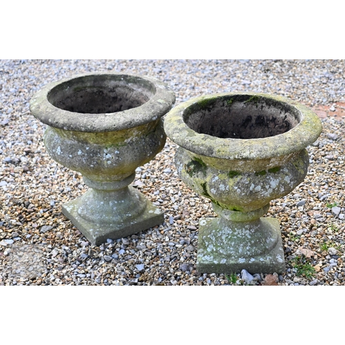 20 - A pair of weathered cast stone tub planters to/w another ornate planter (3)