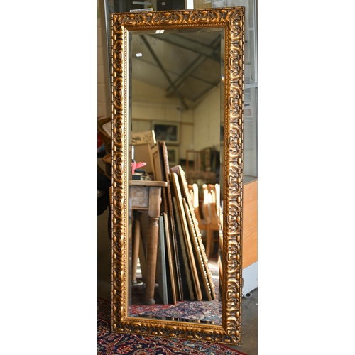 201 - Four graduating wall mirrors with moulded foliate gilt frames, two with bevelled plate and one havin... 