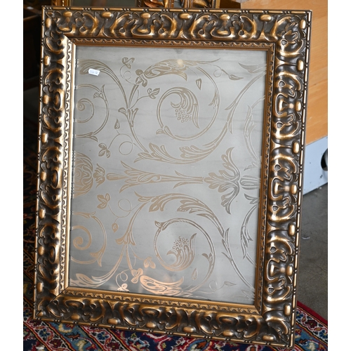 201 - Four graduating wall mirrors with moulded foliate gilt frames, two with bevelled plate and one havin... 