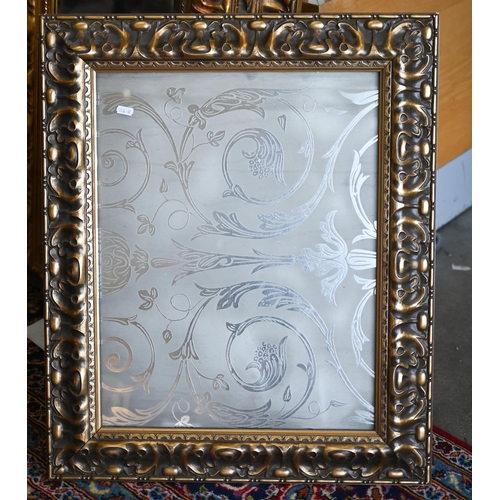 201 - Four graduating wall mirrors with moulded foliate gilt frames, two with bevelled plate and one havin... 