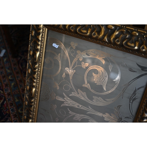 201 - Four graduating wall mirrors with moulded foliate gilt frames, two with bevelled plate and one havin... 