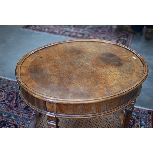 204 - A French Louis XVI style oval side table with single drawer, tapering supports and caned under-tier,... 