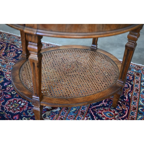 204 - A French Louis XVI style oval side table with single drawer, tapering supports and caned under-tier,... 