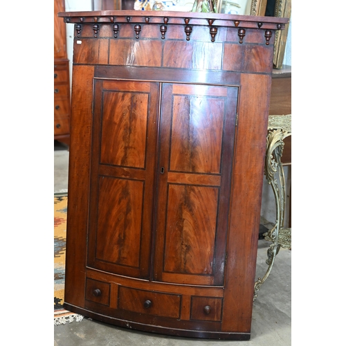 207 - An antique mahogany barrel front corner cupboard, 80 cm w x 120 cm h