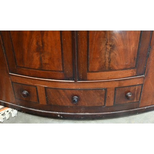 207 - An antique mahogany barrel front corner cupboard, 80 cm w x 120 cm h