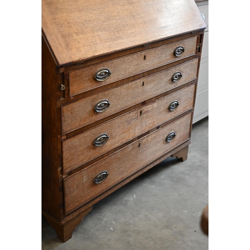 214 - A George III oak fall front bureau with fitted interior over four long graduated drawers, 106 x 50 x... 