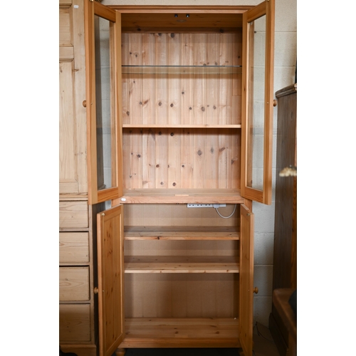 216 - Modern stained pine part-glazed dresser/display cabinet, 82 x 208 x 42 cm