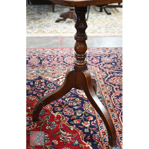 225 - A 19th century mahogany tilt top occasional table on turned column and triform supports, to/w a foot... 