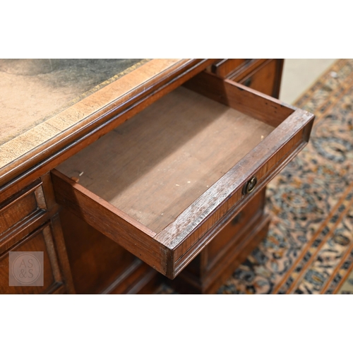 226 - Antique mahogany kneehole desk with tooled leather top (worn) over central recessed cupboard surroun... 