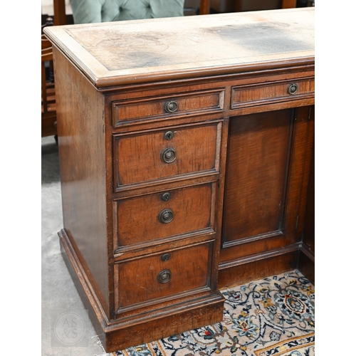 226 - Antique mahogany kneehole desk with tooled leather top (worn) over central recessed cupboard surroun... 