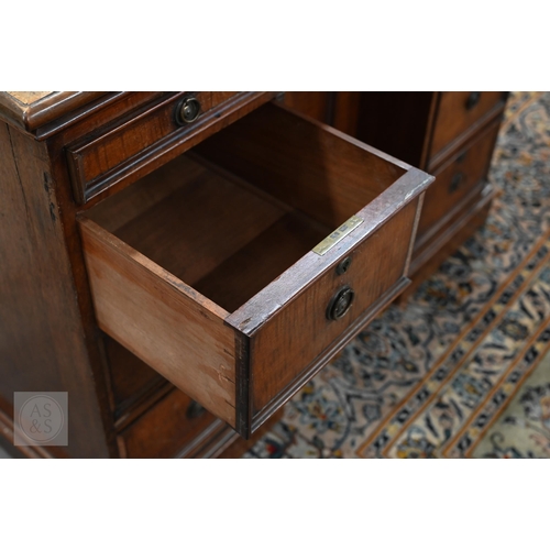 226 - Antique mahogany kneehole desk with tooled leather top (worn) over central recessed cupboard surroun... 