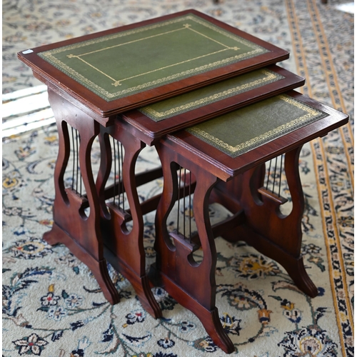 233 - Nest of three tables with inset glass tops and gilt mounts to/w a nest of three tables with green le... 