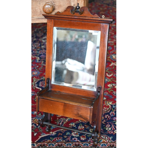 238 - An antique mahogany framed shaving mirror with bevelled glass, vanity box and brass towel rail, 70 x... 