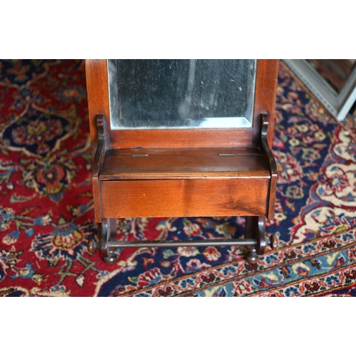 238 - An antique mahogany framed shaving mirror with bevelled glass, vanity box and brass towel rail, 70 x... 