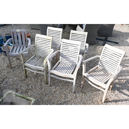 24 - A set of six unbranded weathered teak garden armchairs, some a/f (6)