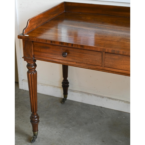 240 - A Victorian mahogany two drawer side table on turned reeded supports and brass castors, 100 x 60 x 8... 