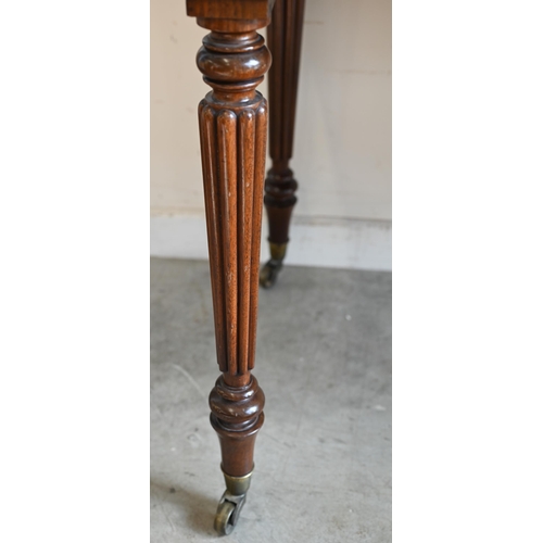 240 - A Victorian mahogany two drawer side table on turned reeded supports and brass castors, 100 x 60 x 8... 